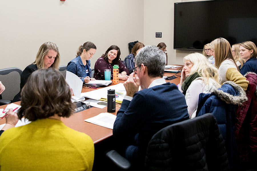 Group of people sitting around a table